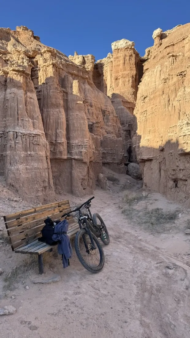 A bike leaning at the entrance of a Cathedral Gorge slot canyon