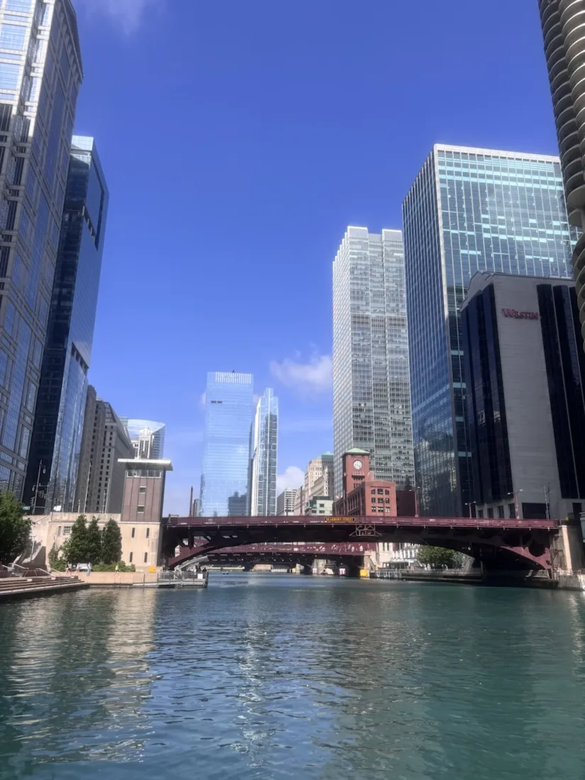 The Chicago River and a red bascule bridge, downtown towers on both banks
