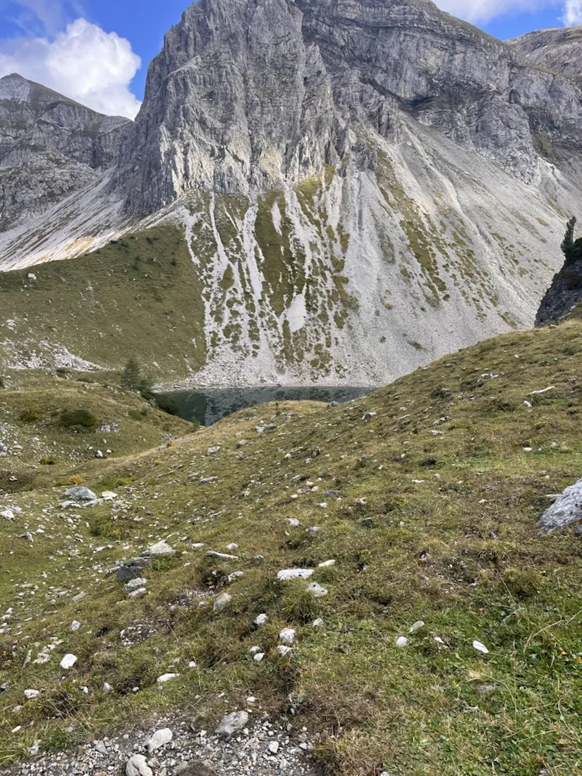 The Wildsee in its cirque, dark green under the Großwandspitze