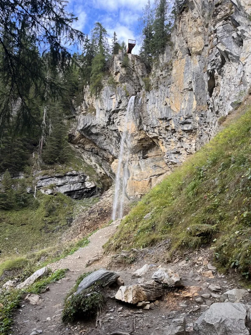 The Johanneswasserfall — 60 metres, with a viewing platform on the lip and a path behind the water
