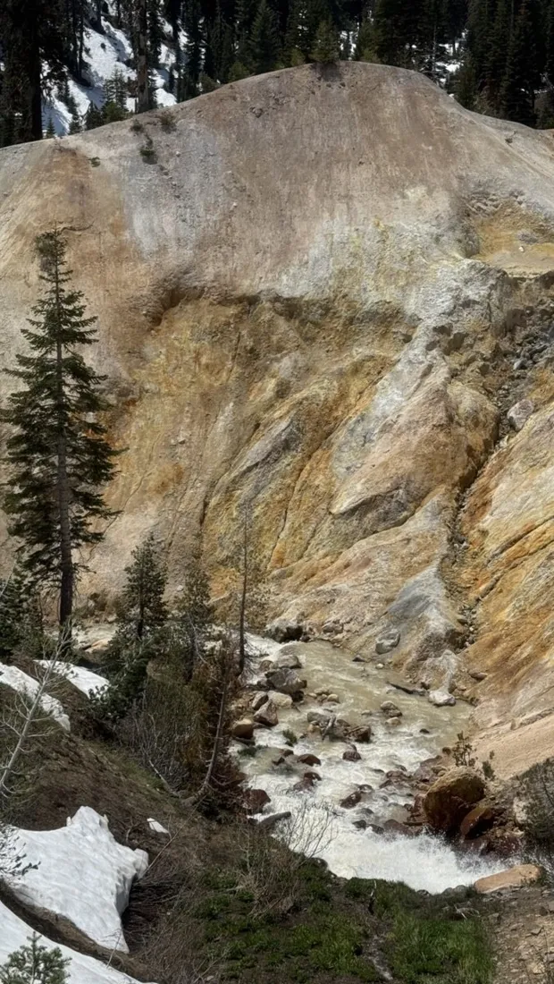 Yellow sulphur cliffs steaming beside the road