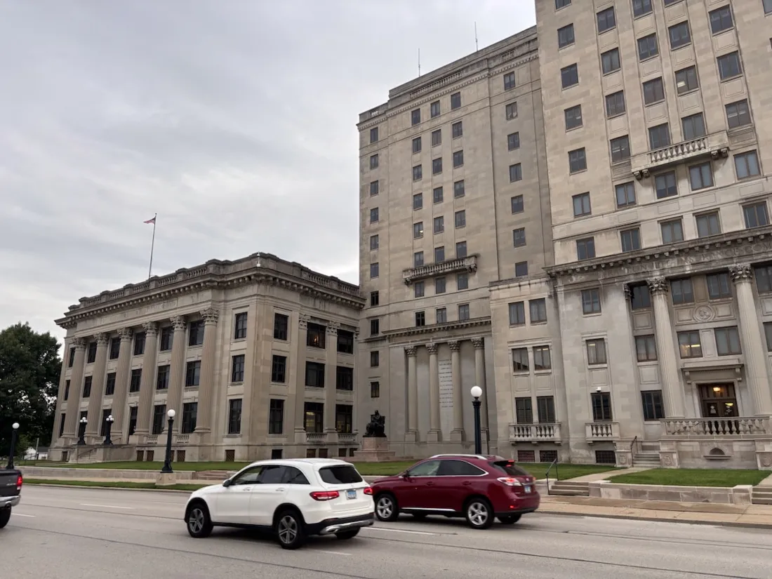 Grand limestone state office buildings with a seated Lincoln statue, downtown Springfield